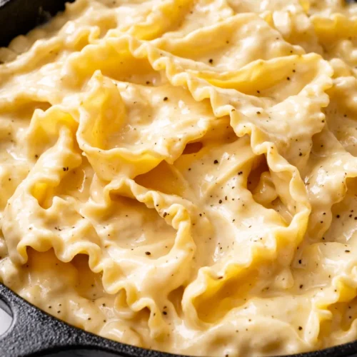 Creamy one skillet lasagna with layers of tender pasta, ricotta, mozzarella, and marinara, golden and bubbly on top.