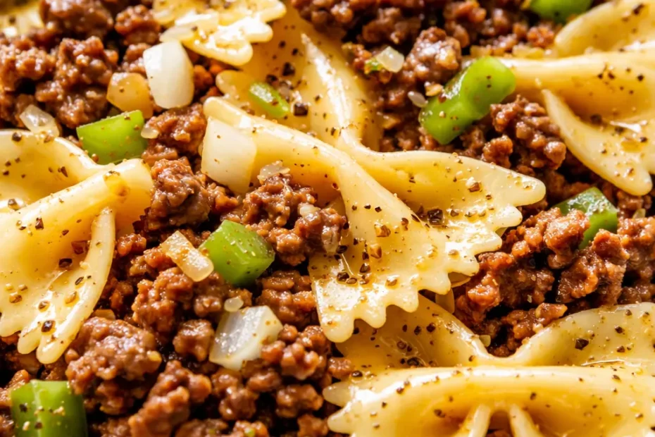 Garlic butter bowtie pasta with beef, golden butter sauce coating tender farfalle and browned ground beef, topped with fresh parsley.