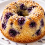 Lavender blueberry tea cakes with tender crumb, dotted with blueberries and topped with lavender buds