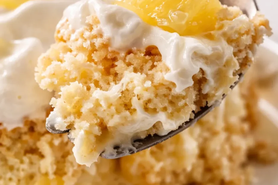 Fluffy pineapple tres leches cake on a white platter, topped with whipped cream and pineapple tidbits, showing an airy crumb and creamy soak
