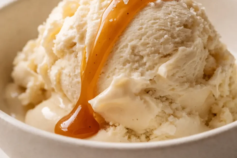 Creamy Ninja Creami salted caramel protein ice cream in a bowl, smooth texture with caramel swirls and flaky sea salt on top