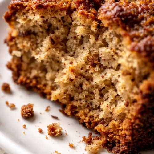 Moist and tender slice of Starbucks pumpkin bread copycat, golden-brown with a spiced crumb visible