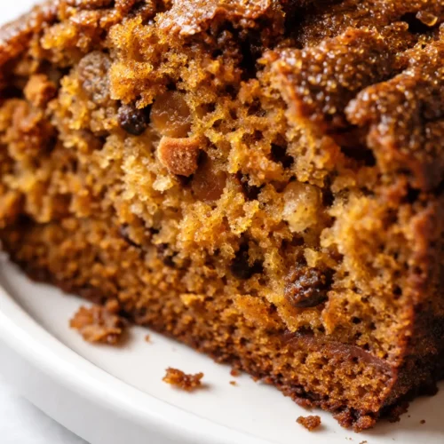 Moist and spiced Starbucks copycat pumpkin bread slice with golden-orange crumb and a signature crackly top