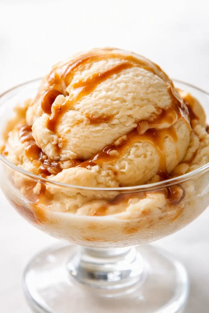 Creamy Bailey's Irish Cream ice cream scoop with smooth, velvety texture and a pale golden color, ready to serve.